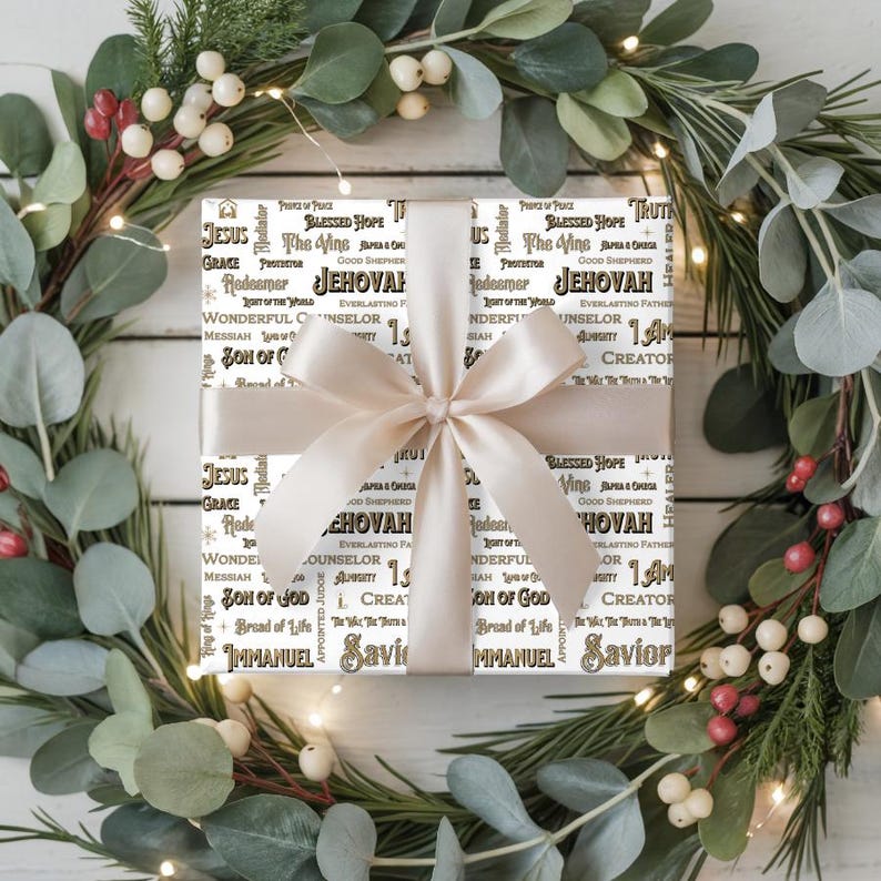May include: A wrapped gift with a cream-colored bow, surrounded by a festive wreath of greenery and berries. The gift wrap features religious text in black and gold lettering, including the words "Jesus" and "Jehovah".
