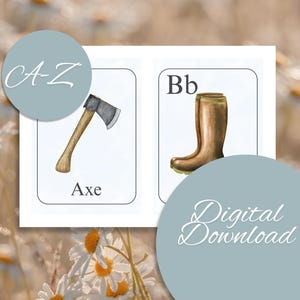May include: Watercolor illustrations of an axe and a brown boot on white cards. The axe card has the word "Axe" below the image, and the boot card has the letter "Bb". The cards are set against a blurred background with the text "A-Z" and "Digital Download".