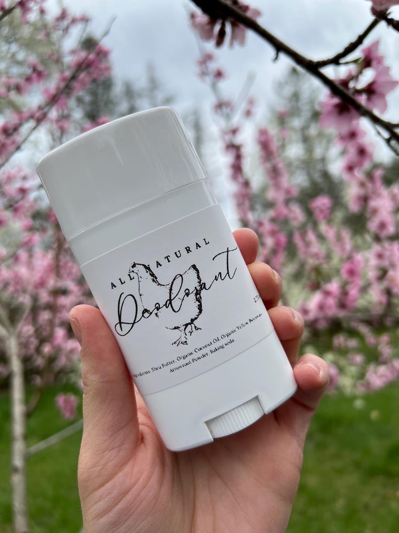May include: White deodorant stick with a black label that reads "ALL NATURAL Deodorant". The label also lists the ingredients: Shea Butter, Organic Coconut Oil, Organic Yellow  Beeswax, Arrowroot Powder, Baking Soda.