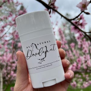 May include: White deodorant stick with a black label that says "ALL NATURAL Deodorant". The label also lists the ingredients: Shea Butter, Organic Coconut Oil, Organic Yellow  Beeswax, Arrowroot Powder, Baking Soda.