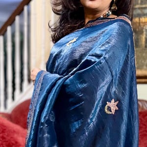 Teal blue crushed tissue silk Saree with cross stitch embroideries