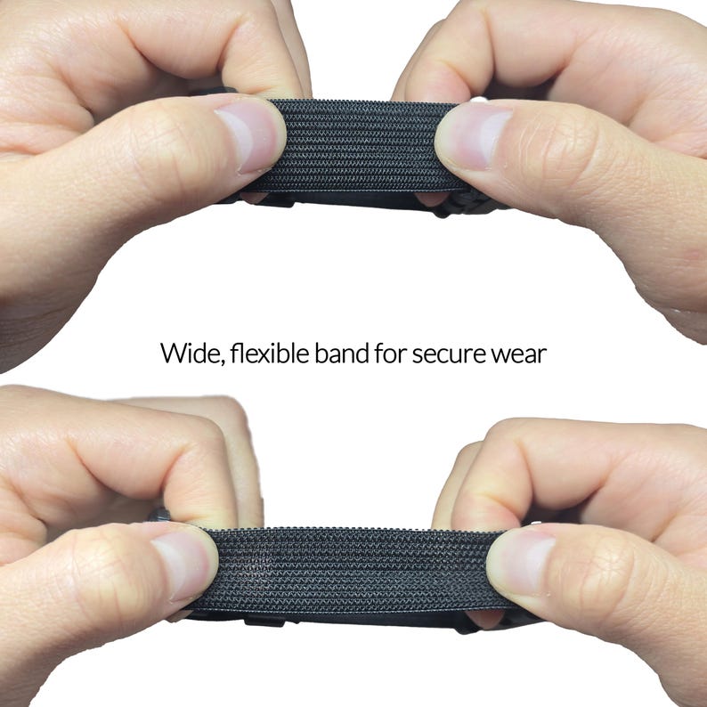 May include: Close-up of a wide, black, flexible band being stretched between two hands. The band has a textured surface. Text on the image reads: "Wide, flexible band for secure wear."