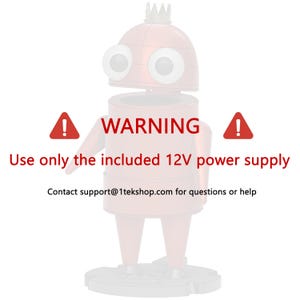 May include: A red robot figure with a crown on its head and large eyes. Text reads: WARNING. Use only the included 12V power supply. Contact support@1tekshop.com for questions or help. The robot stands on a circular base with two arms and legs.