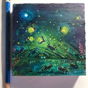 May include: A small wooden painting of a night scene with fireflies and crickets. The painting is on a dark blue background with a bright green field in the foreground. The fireflies are yellow and the crickets are black. The painting is signed "glaskch" in the bottom right corner.