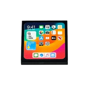 May include: A black square with a colorful screen displaying a phone's home screen. The screen shows app icons, the time 9:41, and the date. The background has a gradient of colors including orange, pink, and blue.