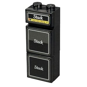 May include: A black toy amplifier stack with the word "Stack" in white lettering on each section. The top section has two black knobs and a small display with yellow and red details. The stack is made of plastic.