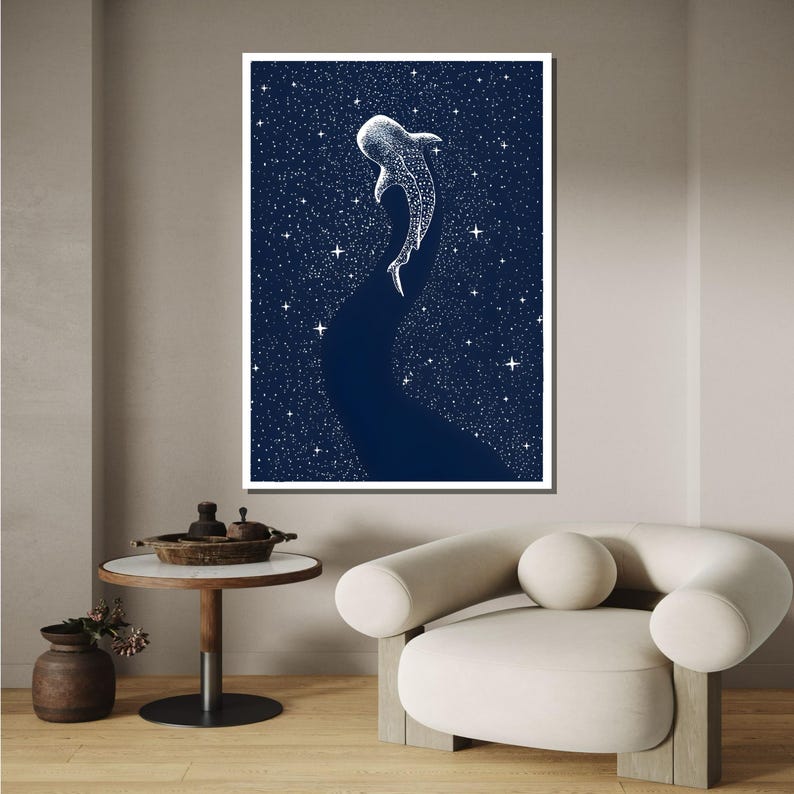 May include: A white whale shark silhouette swimming upwards against a dark blue background with white stars. The whale shark is made up of white stars.