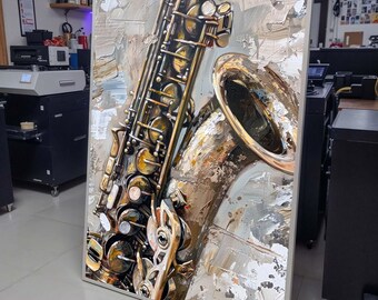 May include: A close-up of a painting of a gold saxophone with a textured background. The painting is framed in a silver frame.