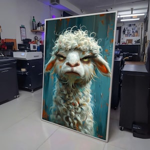 May include: A framed art print featuring a whimsical illustration of a grumpy-looking llama. The llama has white, curly fur, orange ears, and an intense expression. The background is a textured teal and orange abstract design.
