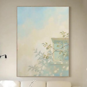 Puede incluir: Una taza de cerámica blanca con un asa negra y el texto "But first, coffee" en un estilo manuscrito. La taza está sobre una superficie blanca. La taza es probablemente para bebidas calientes.