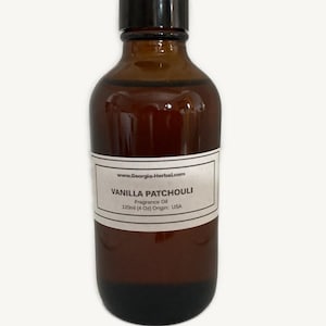 May include: A brown glass bottle with a black cap. The bottle has a white label with the text "Vanilla Patchouli Fragrance Oil 120ml (4 Oz) Origin: USA" and the website address www.Georgia-Herbal.com. The bottle is filled with a dark liquid.