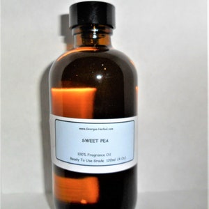 May include: A brown glass bottle with a black cap, labeled "SWEET PEA 100% Fragrance Oil Ready To Use Grade 120ml (4 oz)".