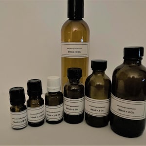 May include: A set of six amber glass bottles with black and white labels. The bottles are filled with liquid and range in size from 8 oz to 1/2 oz. The labels include the volume of liquid in both milliliters and ounces.