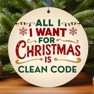 May include: A round Christmas ornament with the text "ALL I WANT FOR CHRISTMAS IS CLEAN CODE" in red, green, and gold. The ornament is cream-colored and hangs from a brown string. Festive holiday decor.