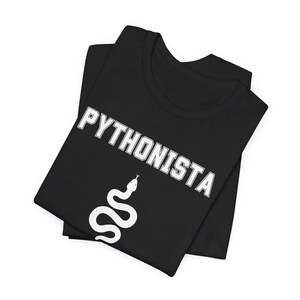 two black t - shirts with white letters on them