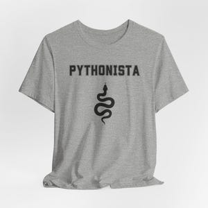 a grey t - shirt with a black and white image of a snake on it