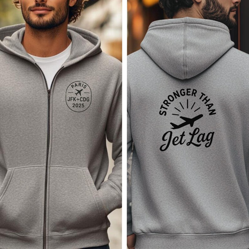 A man wearing a grey hooded sweatshirt with a logo and text on the back.