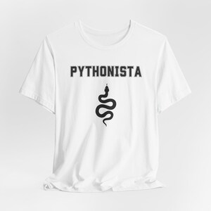 a white t - shirt with a snake on it