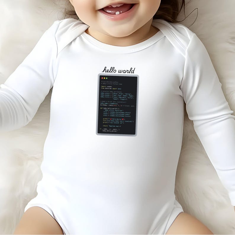 A smiling baby wearing a white onesie with a black text message that says "Hello world" printed on it.