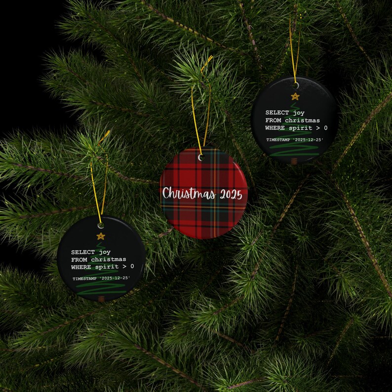 a Christmas tree adorned with three ornaments hanging from its branches. The ornaments are black and red plaid, and they display the text "SELECT joy FROM christmas WHEN spirit > 0" and "Christmas 2015" respectively.