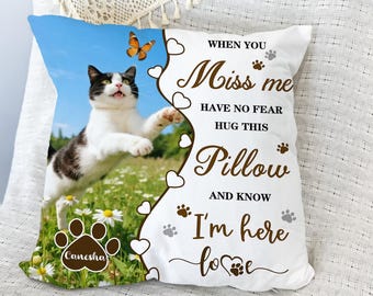 May include: A square pillow featuring a black and white cat leaping in a field of daisies under a blue sky. The pillow has text that reads "When you miss me, have no fear, hug this pillow and know I'm here love."