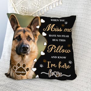 May include: A cushion with a German Shepherd dog image and the text "When you miss me, have no fear, hug this pillow and know I'm here love". The pillow has a black background with white hearts and paw prints. The dog's name is "Canesha".
