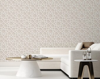 May include: A modern living room with a beige geometric patterned wall. A white sofa and a round coffee table with a gold top are in front of the wall. A small side table with a gold base and a white top is next to the sofa.