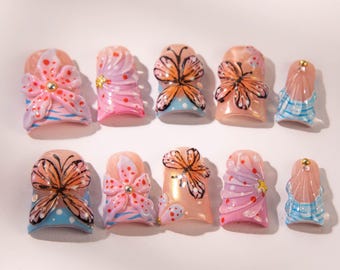 Uñas postizas de mariposa 3D: Diseño de uñas de gel con flores tropicales