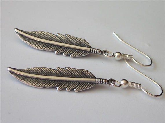 Metallic silver bullet necklace and painted feather earrings