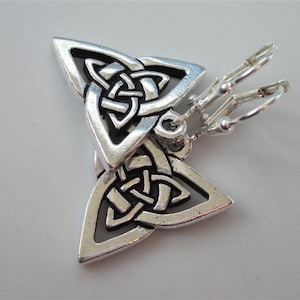 May include: Silver tone Celtic knot earrings with a triangular shape and a leverback closure.