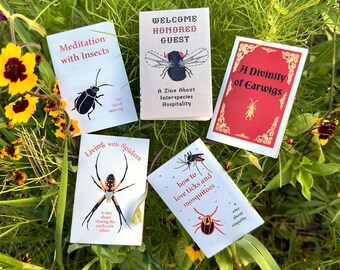 May include: A collection of small zines with insect and arachnid themes. Titles include "Meditation with Insects," "Welcome Honored Guest," "A Divinity of Earwigs," "Living with Spiders," and "How to Love Ticks and Mosquitoes." The zines are set against a backdrop of green foliage and yellow flowers.