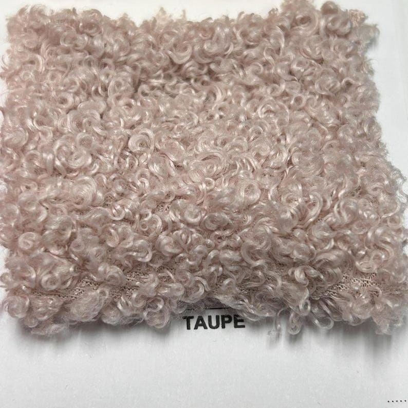 A square swatch of taupe curly teddy fleece fabric with the word TAUPE printed below.
