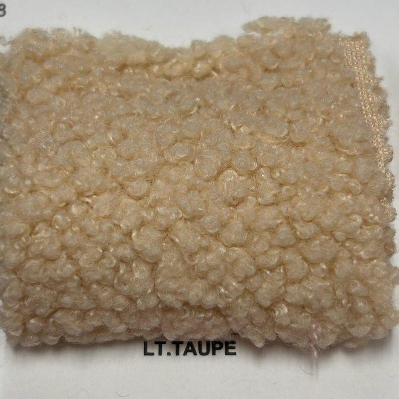 A square swatch of light taupe curly teddy fleece fabric with the words LT.TAUPE printed below.