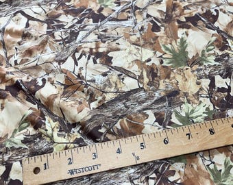 Camouflage Fabric – Realistic Tree Bark & Leaf Pattern for Outdoor Crafts, Hunting, and Apparel.