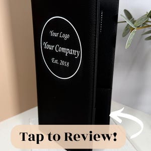 May include: Black leather menu cover with a white circle logo that says "Your Logo Your Company Est. 2018".