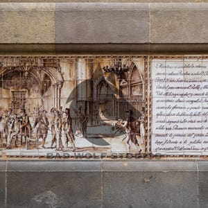 May include: A detailed tile mural depicting a historical scene with figures in period clothing, set within an architectural backdrop. The artwork is in sepia tones, with text on the right side. The mural is framed by a stone wall.