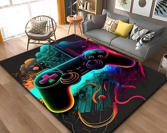 Puede incluir: Una alfombra negra con un diseño de mando de videojuego colorido y de neón. El mando está rodeado de líneas y formas abstractas.