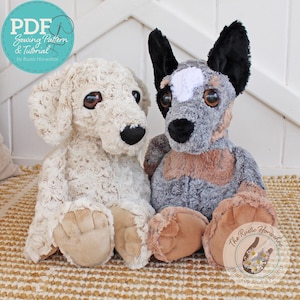 May include: Two plush toy dog patterns, a cream coloured dog with a curly fur texture and a grey and brown dog with black ears. The dogs are sitting on a woven rug with a white background.