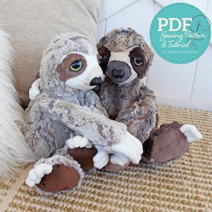 May include: Two plush sloth toys with soft, textured fur in shades of light grey and dark brown. Each sloth features large, dark eyes, a prominent snout, and white claws on its feet. A circular teal graphic with the text PDF Sewing Pattern & Tutorial by Rustic Horseshoe is visible in the upper right corner.