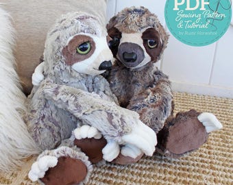 May include: Two plush sloth toys with soft, textured fur in shades of light grey and dark brown. Each sloth features large, dark eyes, a prominent snout, and white claws on its feet. A circular teal graphic with the text PDF Sewing Pattern & Tutorial by Rustic Horseshoe is visible in the upper right corner.