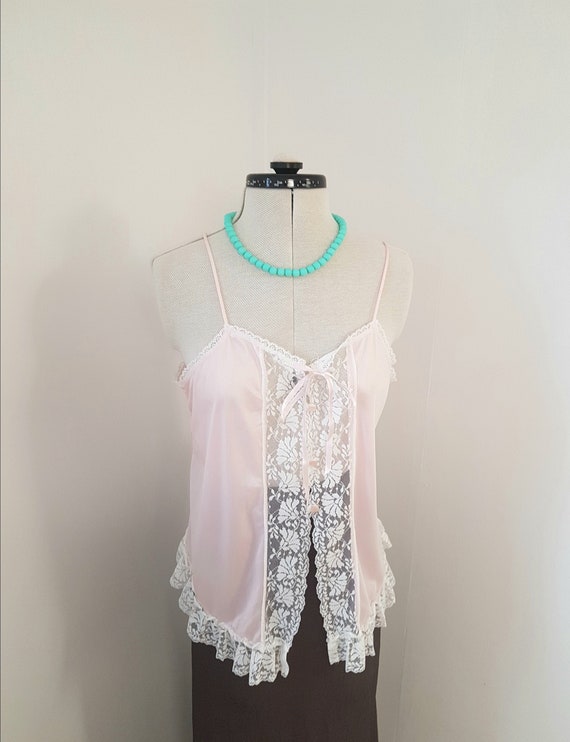 pink vintage camisole, lace trims, little buttons,