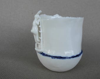 Cup in white porcelain with a rabbit on a ladder - handmade ceramic whimsical vessel