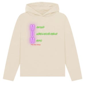 May include: A beige long-sleeve hoodie with a pink and green graphic that reads "MUM" and "Making Unbelievable Magic *On Zero Sleep".
