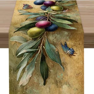 May include: A decorative table runner featuring a painted olive branch with green leaves and colorful olives in shades of green, purple, and blue. Butterflies in shades of blue and orange are scattered around the branch.