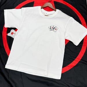 2024 Fun Card Pattern Masculino Malhas 100% Algodão Manga Curta Top Verão Deve ser Casual Masculino e Feminino Camiseta Vintage