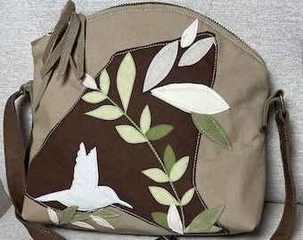 Bird Shoulder Bag, Adjustable 60" Strap, One open inside pocket, 1 Inside Zipper pocket, 1 Large Outer Back Pocket,Applique Sewn Onto Bag,