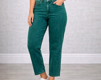 May include: High-waisted denim jeans in a deep forest green color featuring a straight-leg cut, a classic five-pocket design with metal rivets, a button and zipper fly closure, and a standard waistband with belt loops, paired with white sneakers.