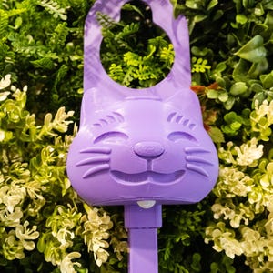 A purple Sidewinder smart cat toy.