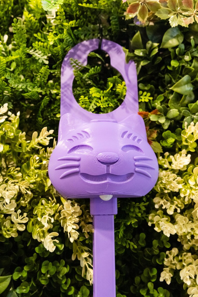 A purple Sidewinder smart cat toy.
