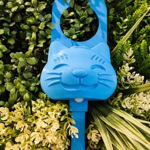 A cyan blue Sidewinder smart cat toy.